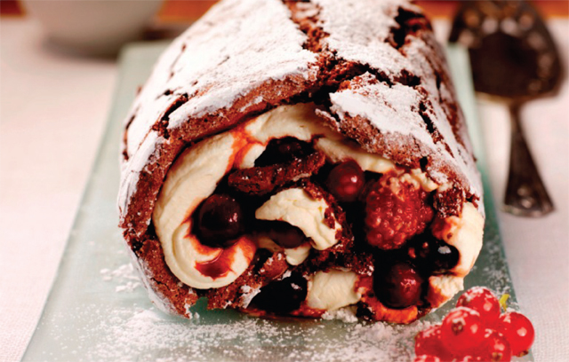 Chocolate roulade with spiced berry compote and cointreau cream 