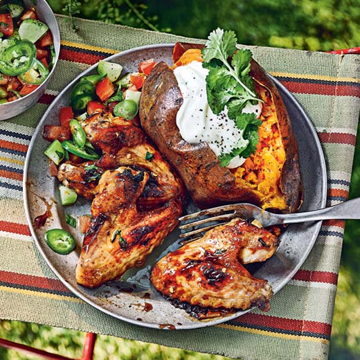 Chicken wings with tamarind, ginger and thyme, baked sweet potatoes and chopped salad