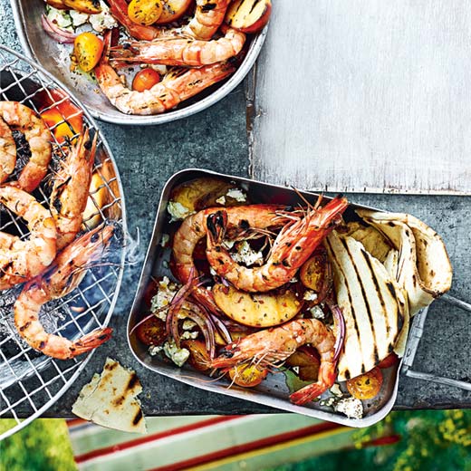 Grilled prawns and peaches with cherry tomatoes, feta and flatbreads