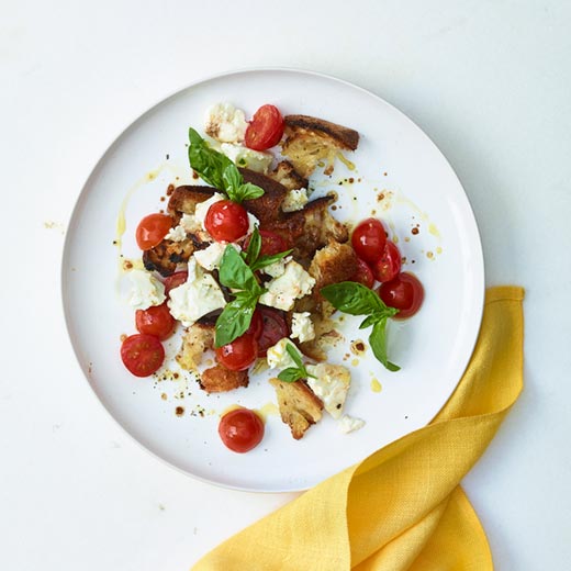 Cherry tomatoes baked with feta and torn bread