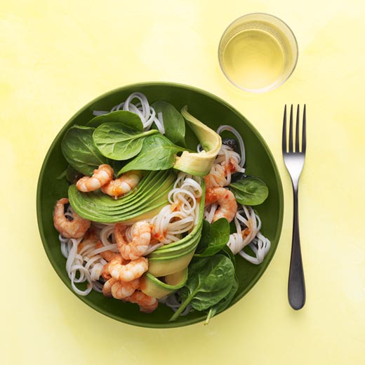 Rice noodle salad with sweet chilli prawns, spinach and avocado