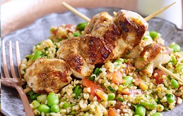Broad bean tabbouleh salad with tomato pesto and chicken skewers